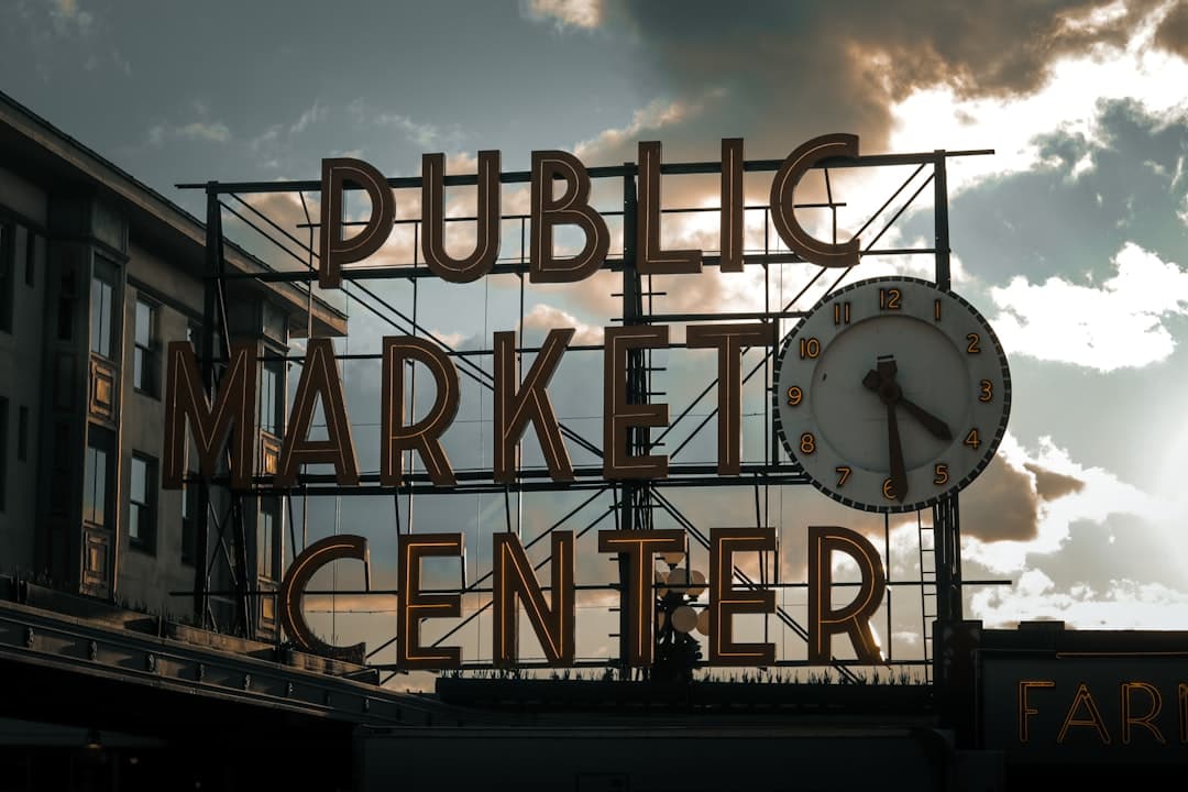 a large sign with a clock on top of it